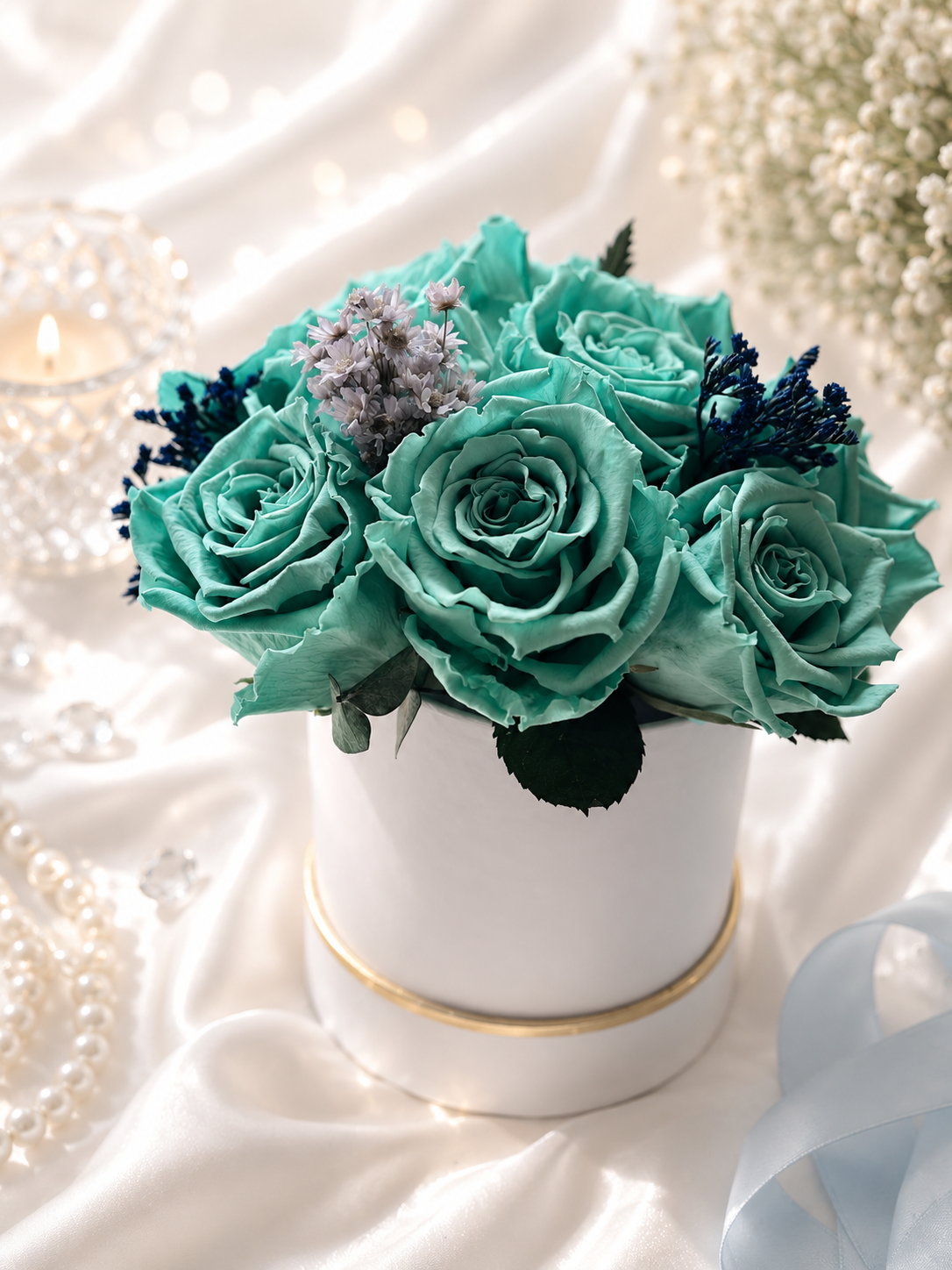 Turquoise roses in a white vase on a soft, light background